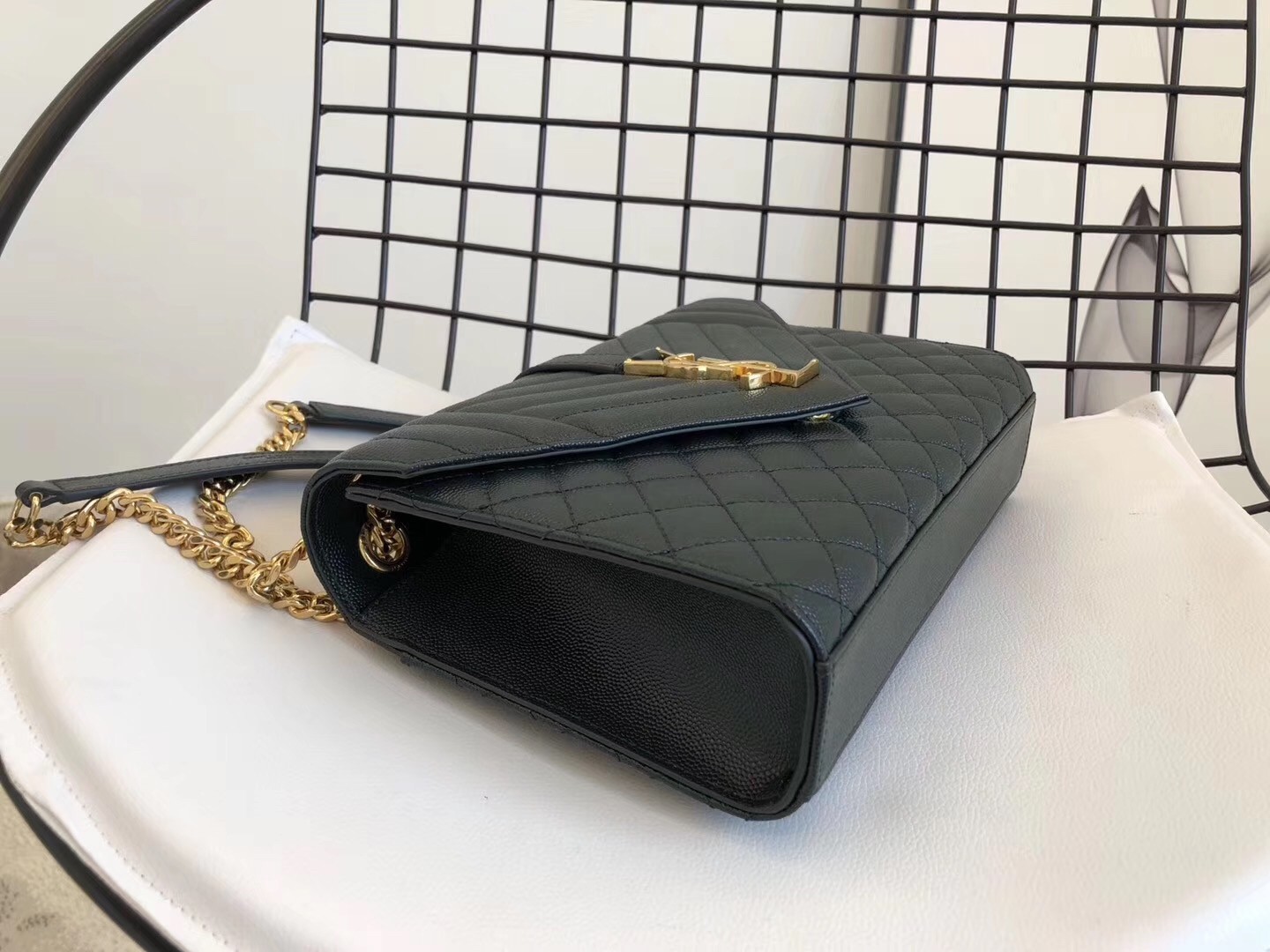 Sa**t Lau*nt medium envelope bag in dark green grained leather