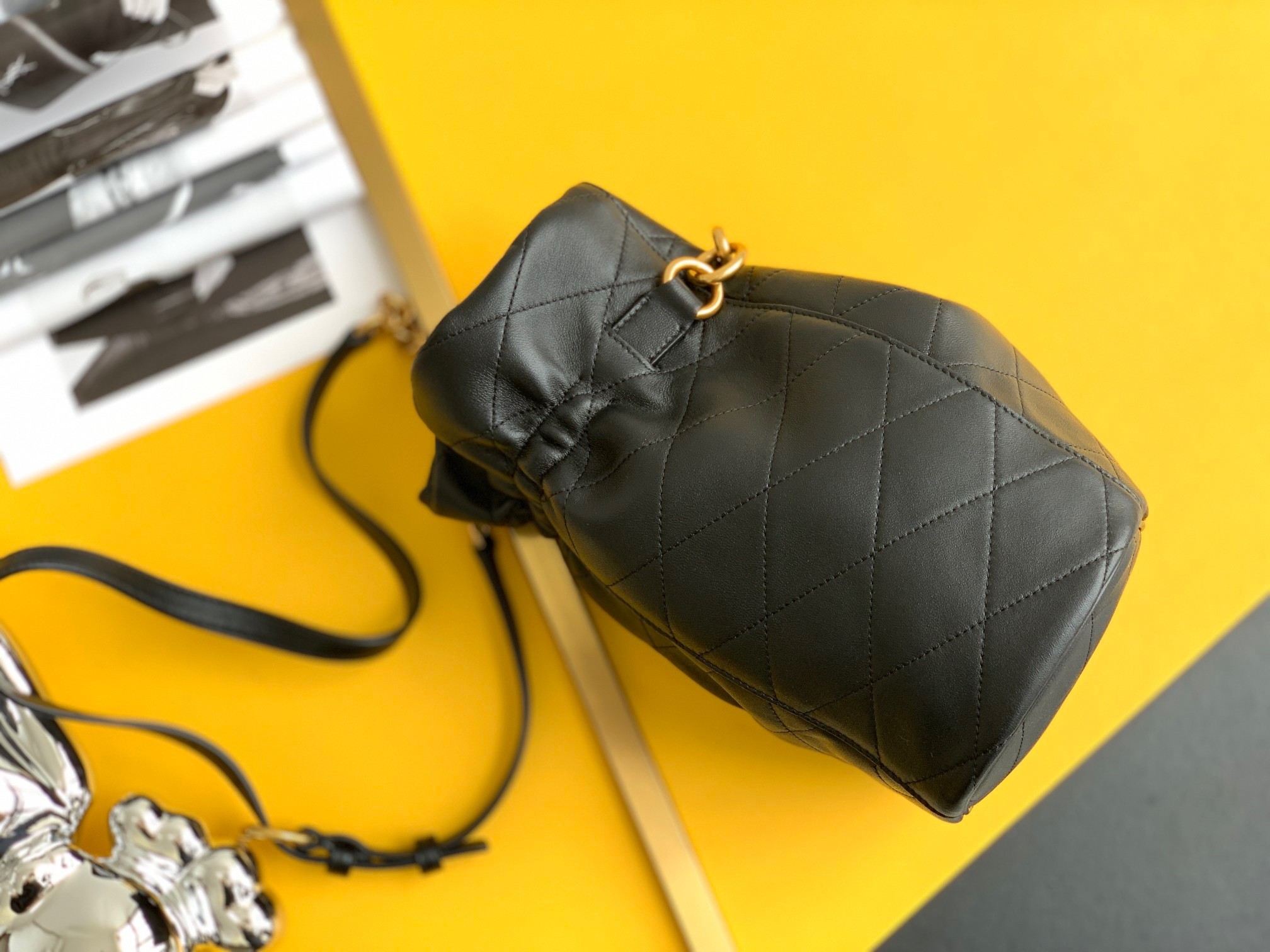 Sa**t Lau*nt le maillon hook bucket bag in black lambskin