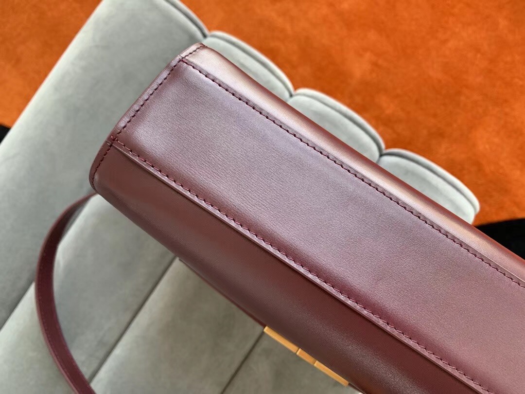 Sa**t Lau*nt manhattan baguette bag in bordeaux calfskin