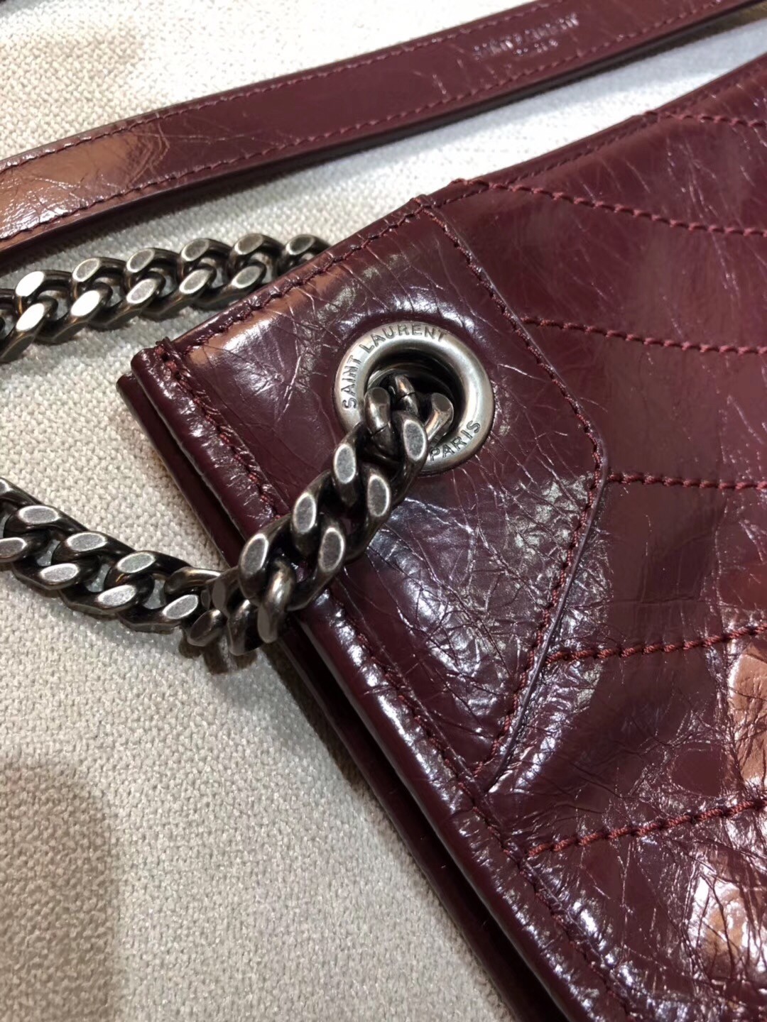 Sa**t Lau*nt medium niki shopping bag in bordeaux leather