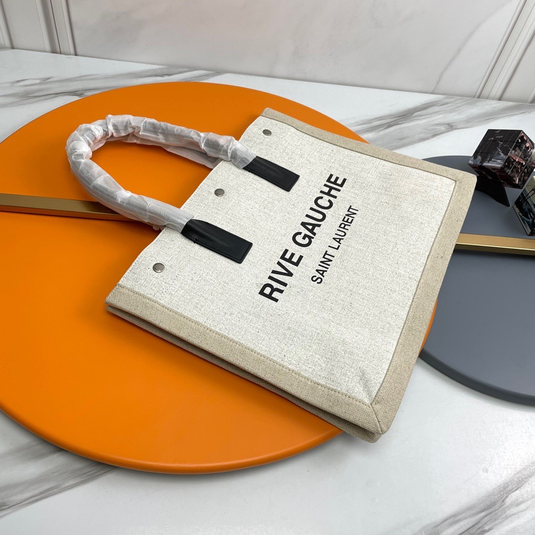 Sa**t Lau*nt rive gauche small tote bag in white linen and leather
